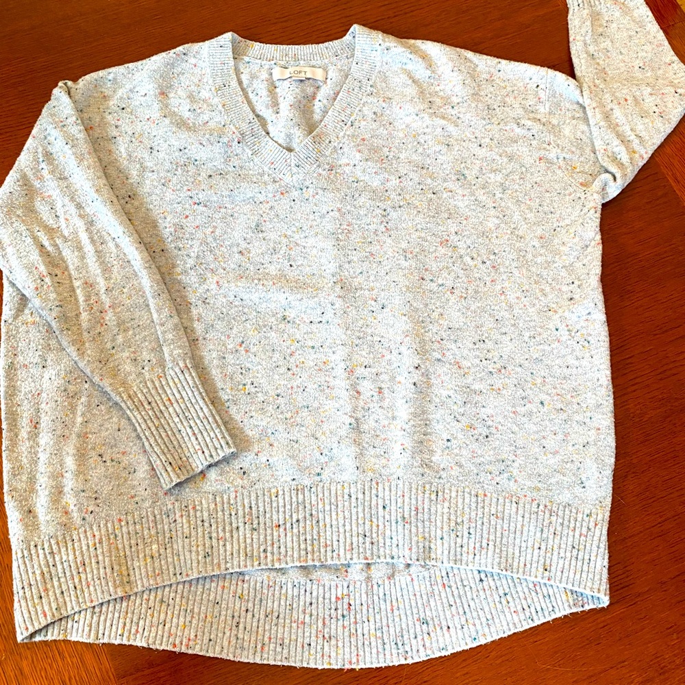 Ladies pullover v-neck sweater. Longer in the back